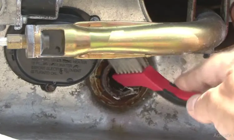 clean the drain port spud threads of suburban rv water heater by using a small wire brush